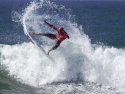 Kelly Slater surfer getting air surfing Trestles